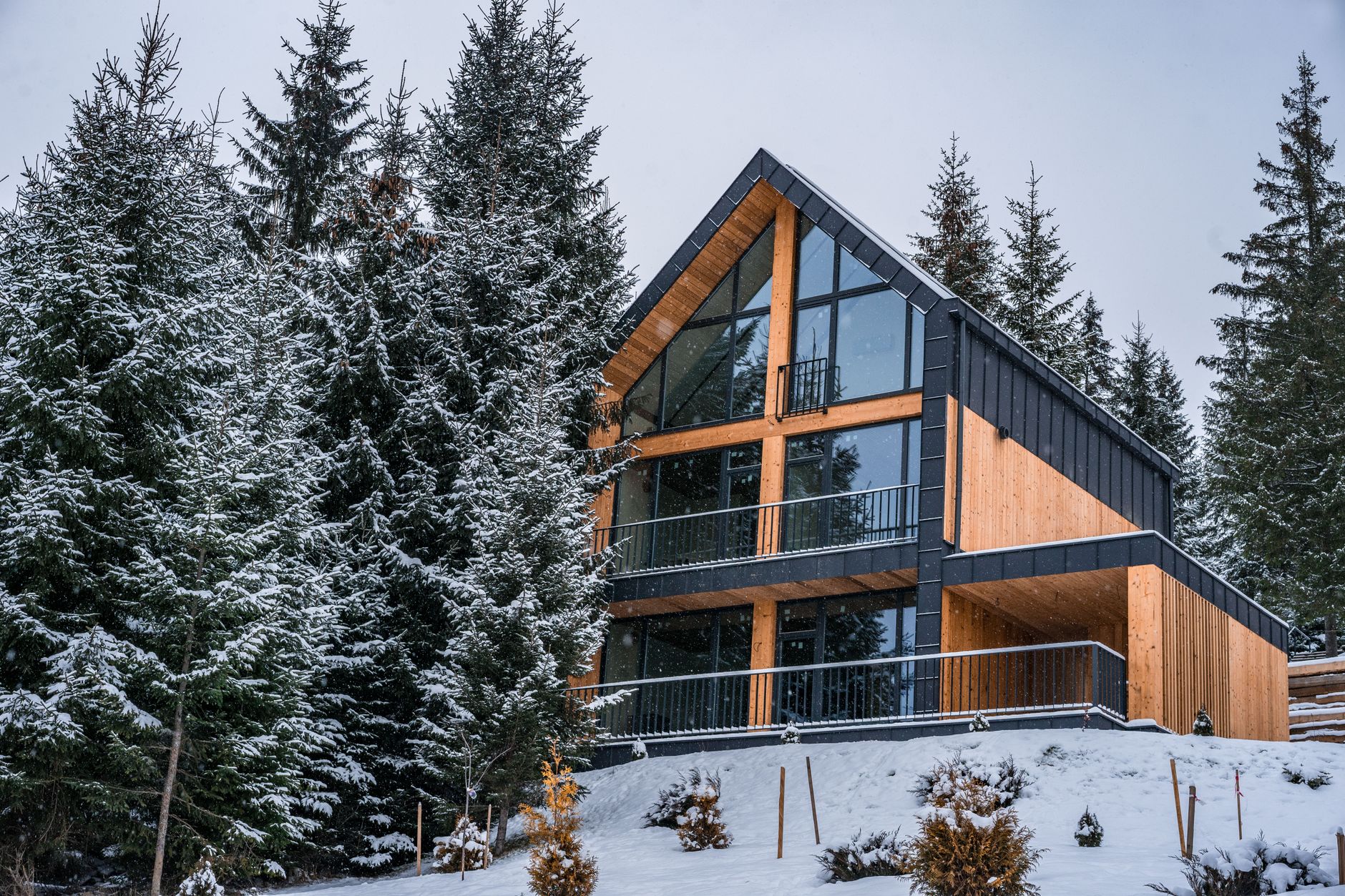High altitude mountain stone chalet covered in winter snow